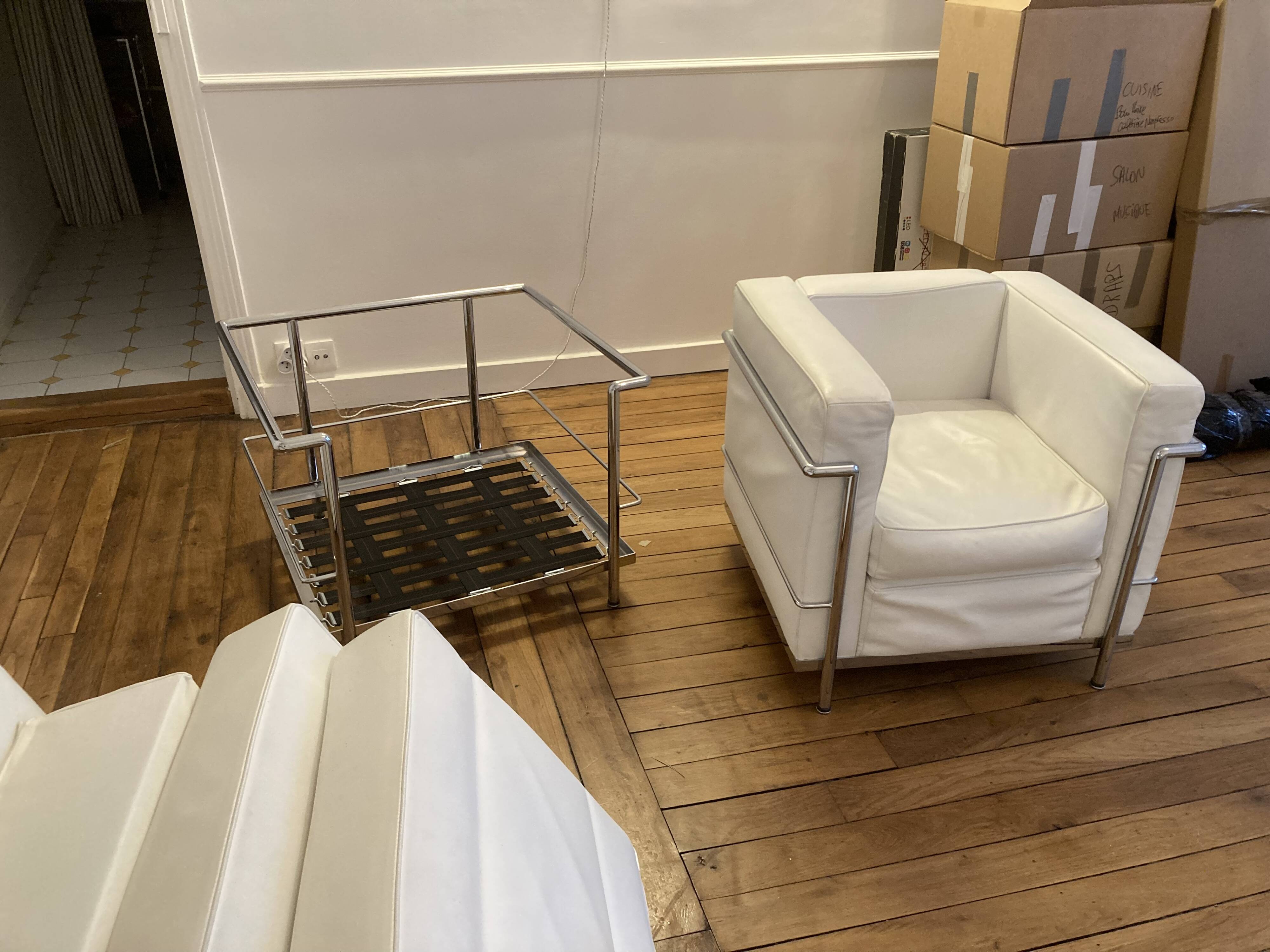 Pair of white leather and chrome armchairs