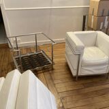 Pair of white leather and chrome armchairs