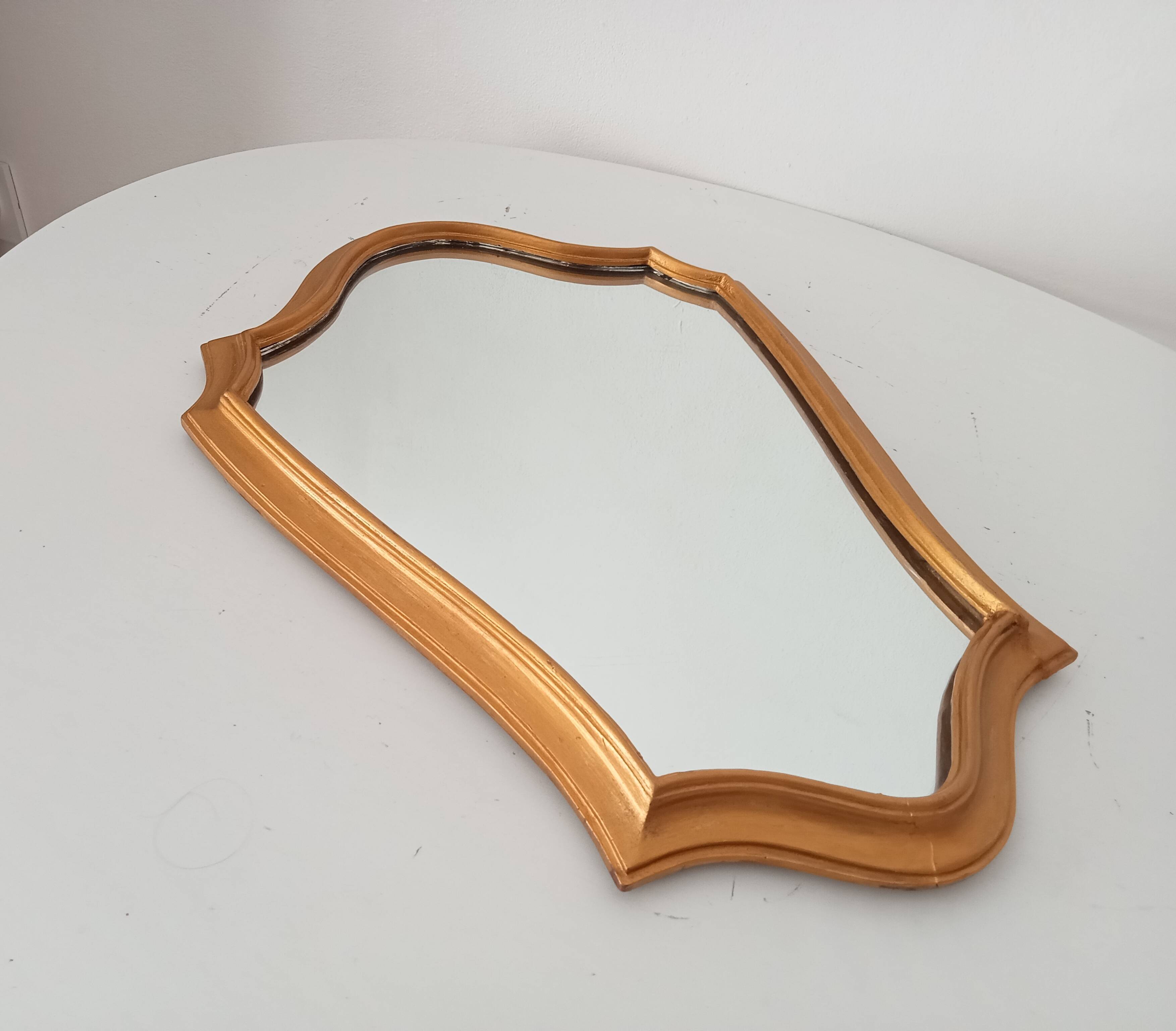 Vintage baroque mirror in gilded wood
