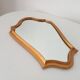 Vintage baroque mirror in gilded wood