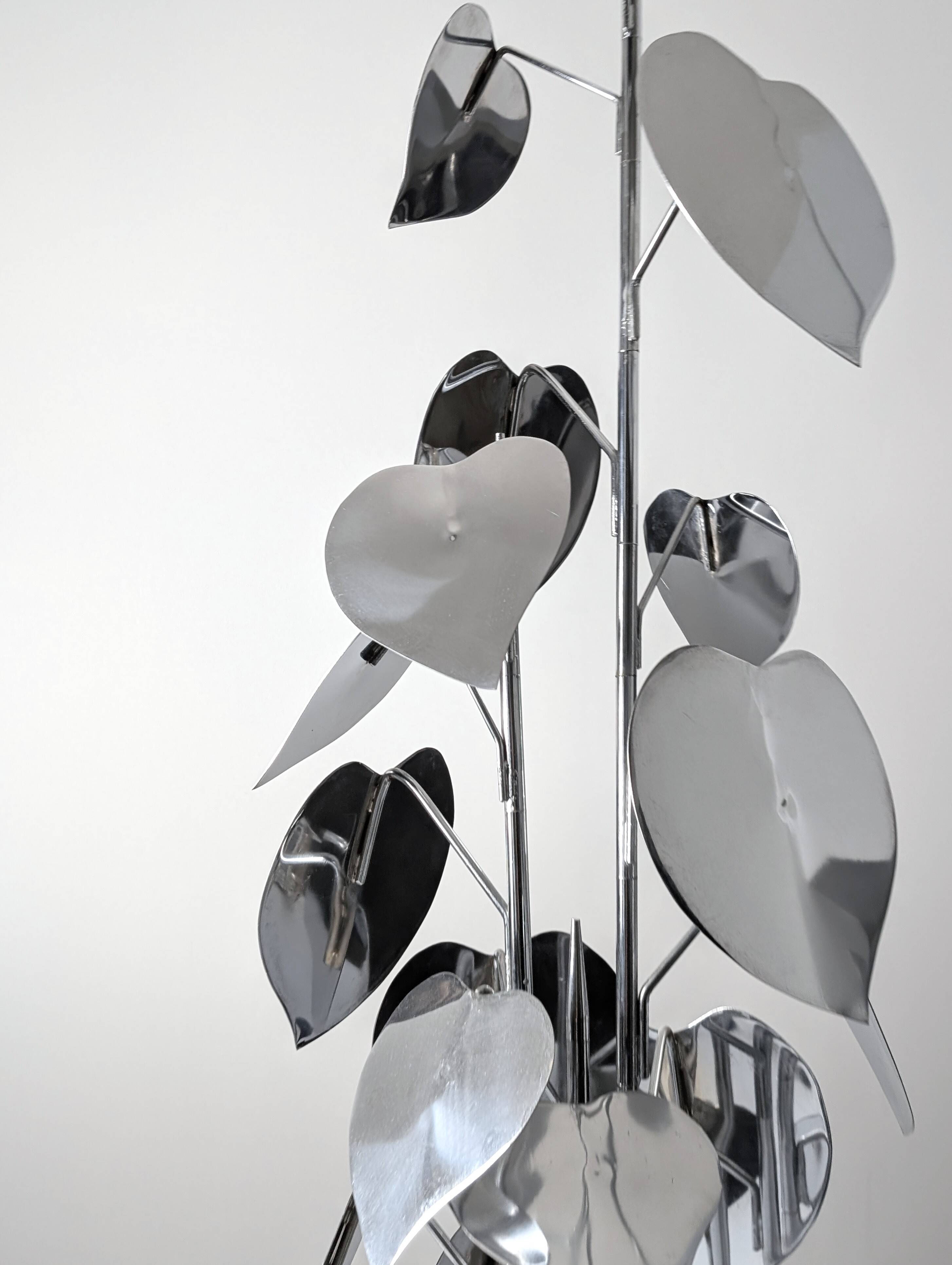 Standing sculpture with chrome leaves and circular base, 1970s