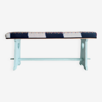 Old blue reupholstered wooden bench