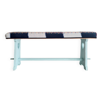 Old blue reupholstered wooden bench