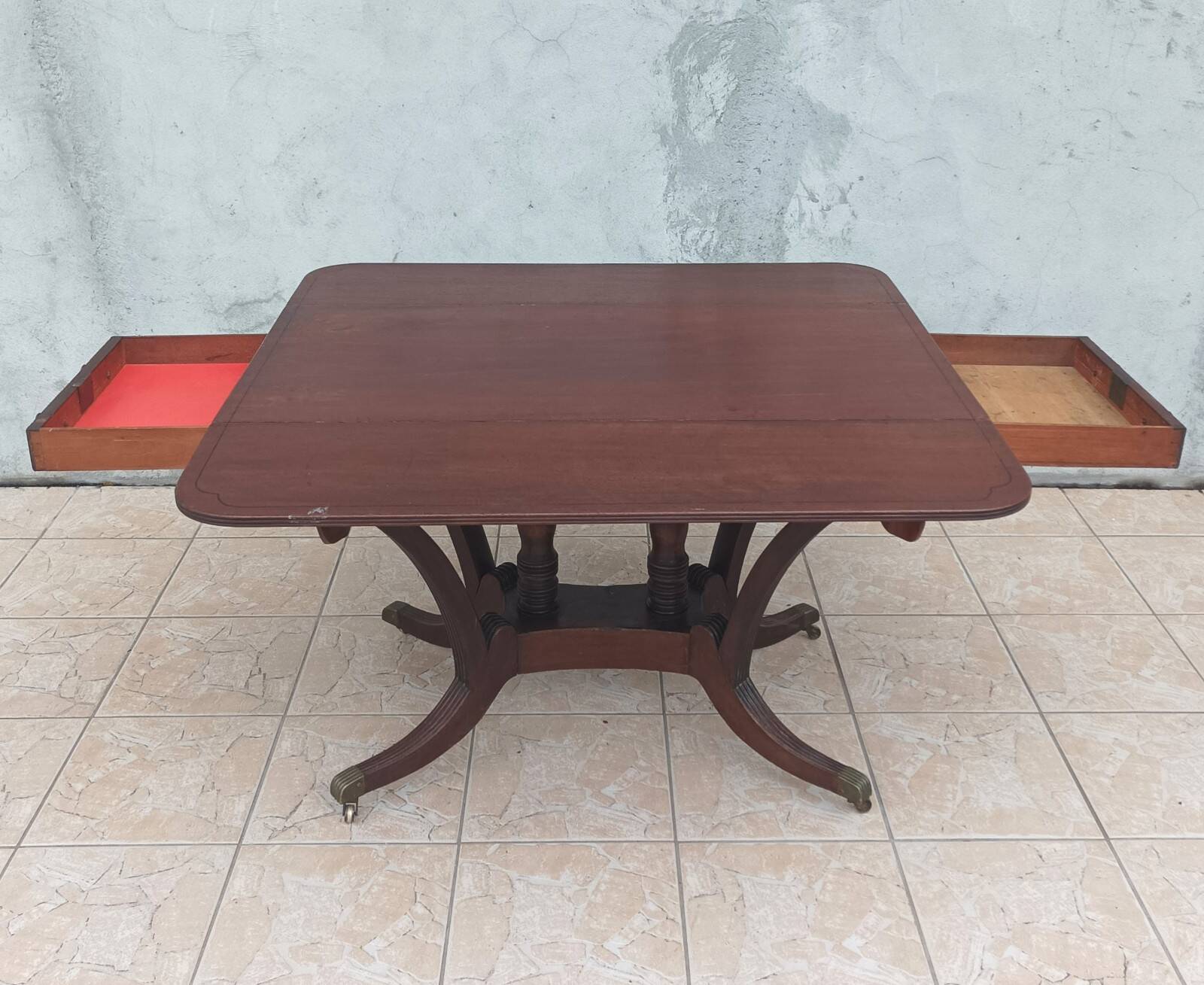 19th-century English style mahogany drop-leaf table.