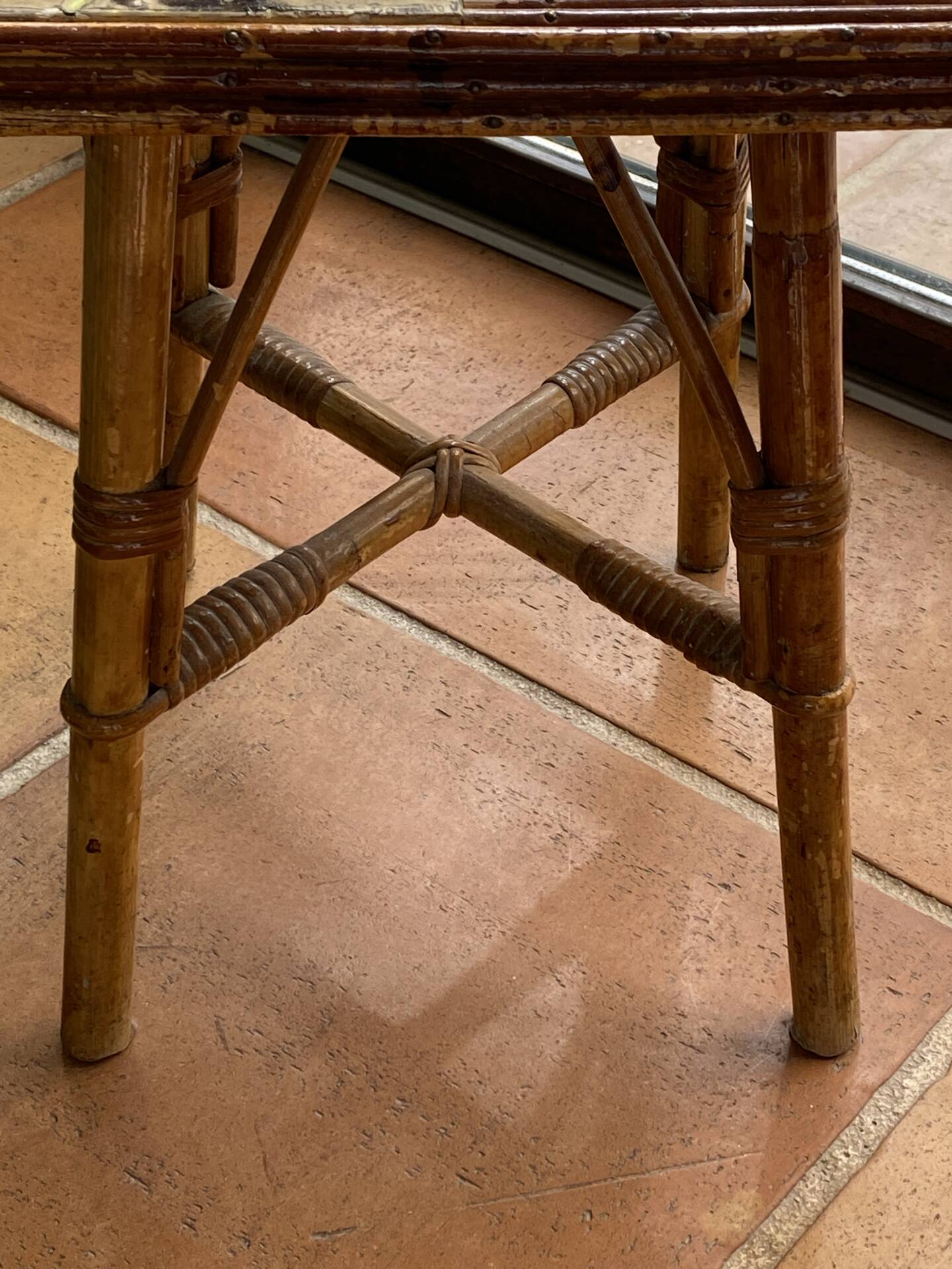 Rattan and ceramic coffee table attributed to Audoux and Minnet.