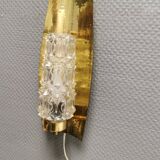 Older wall lamp in brass with hard pressed glass shade.