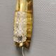 Older wall lamp in brass with hard pressed glass shade.