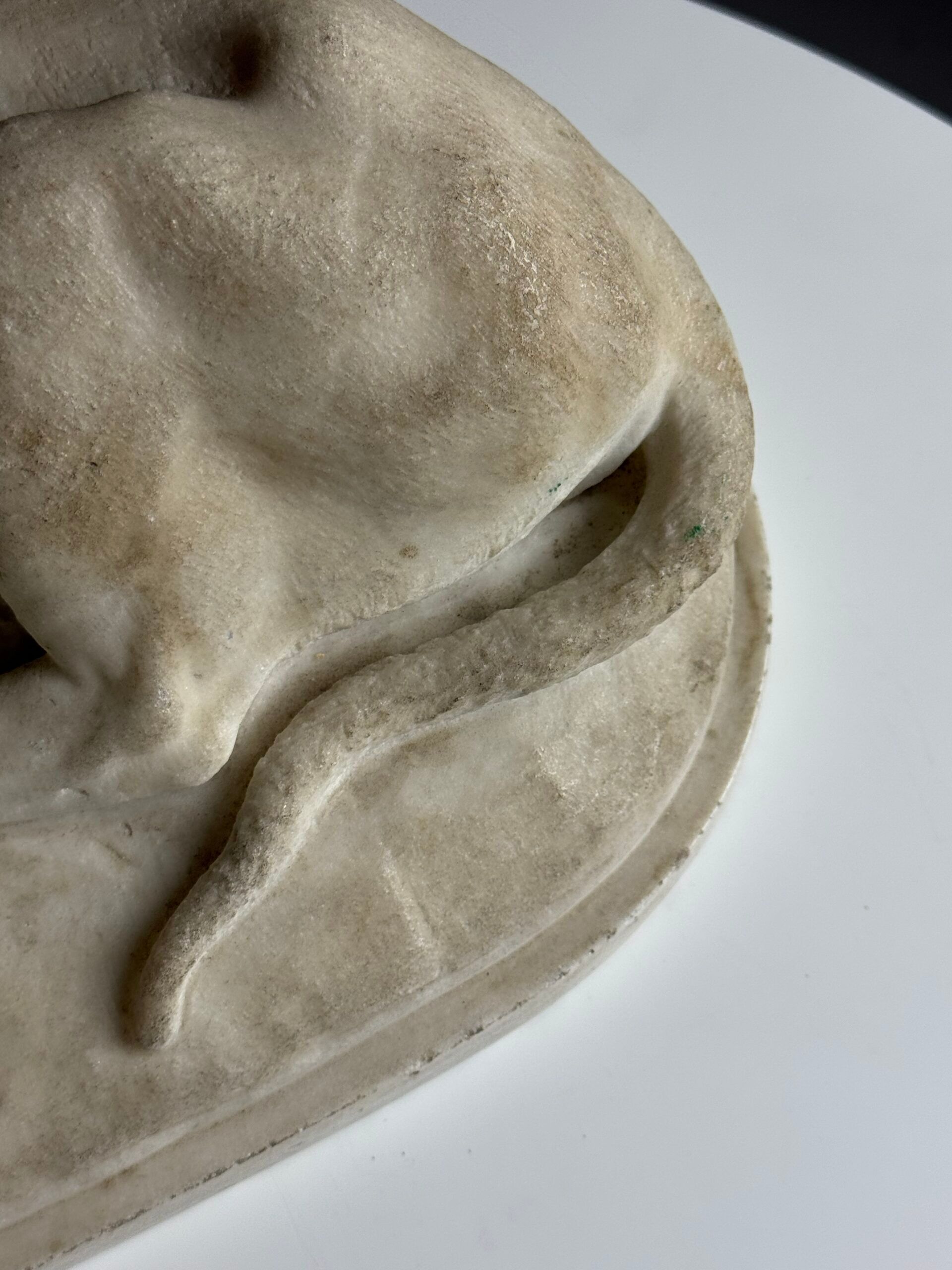 Marble sculpture of a reclining lion
