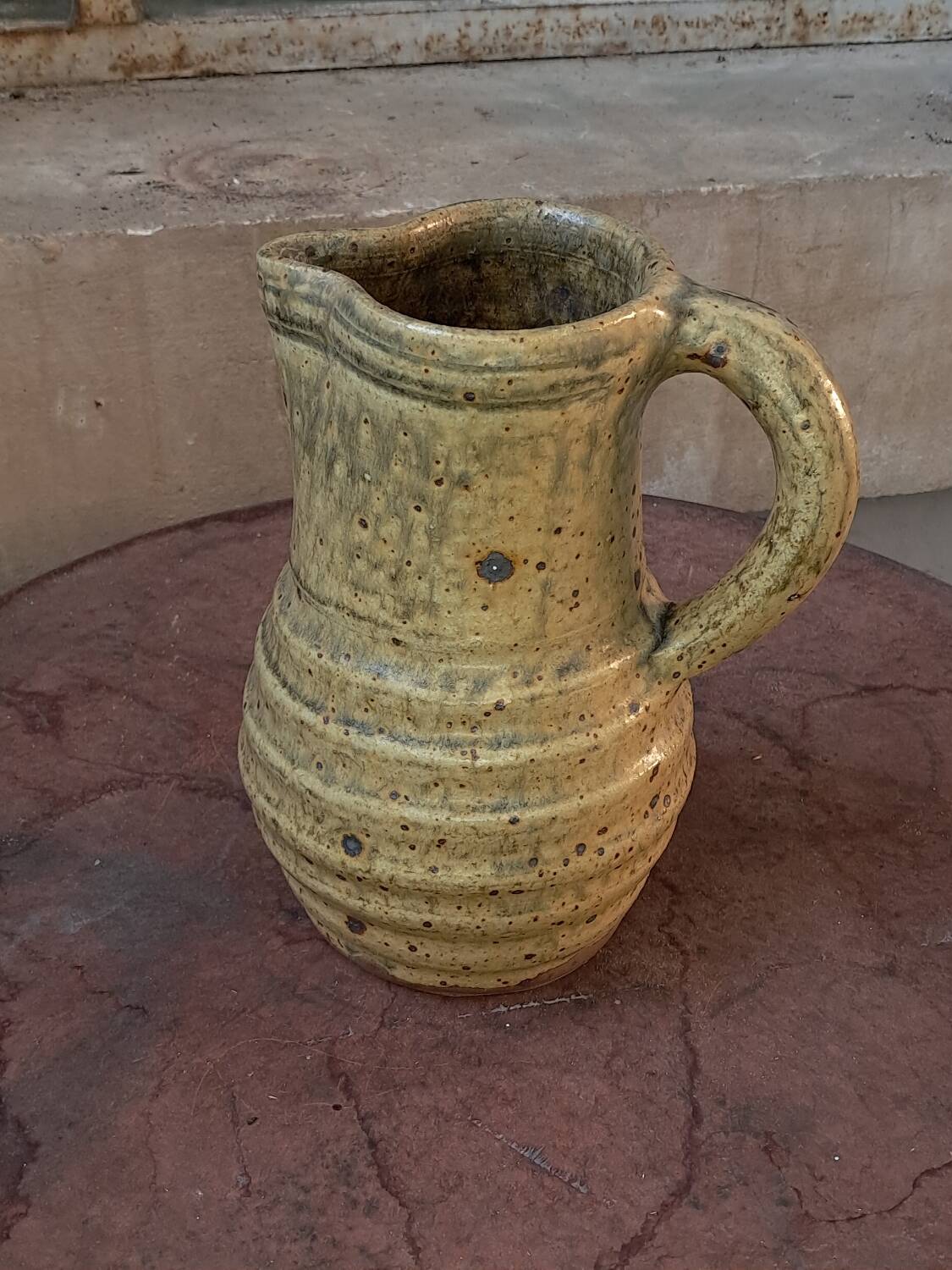 Glazed stoneware pitcher
