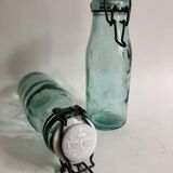 Two bottles with canned goods l'ideale