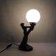 Art Deco lamp woman holding a luminous globe – Vintage resin lamp – L