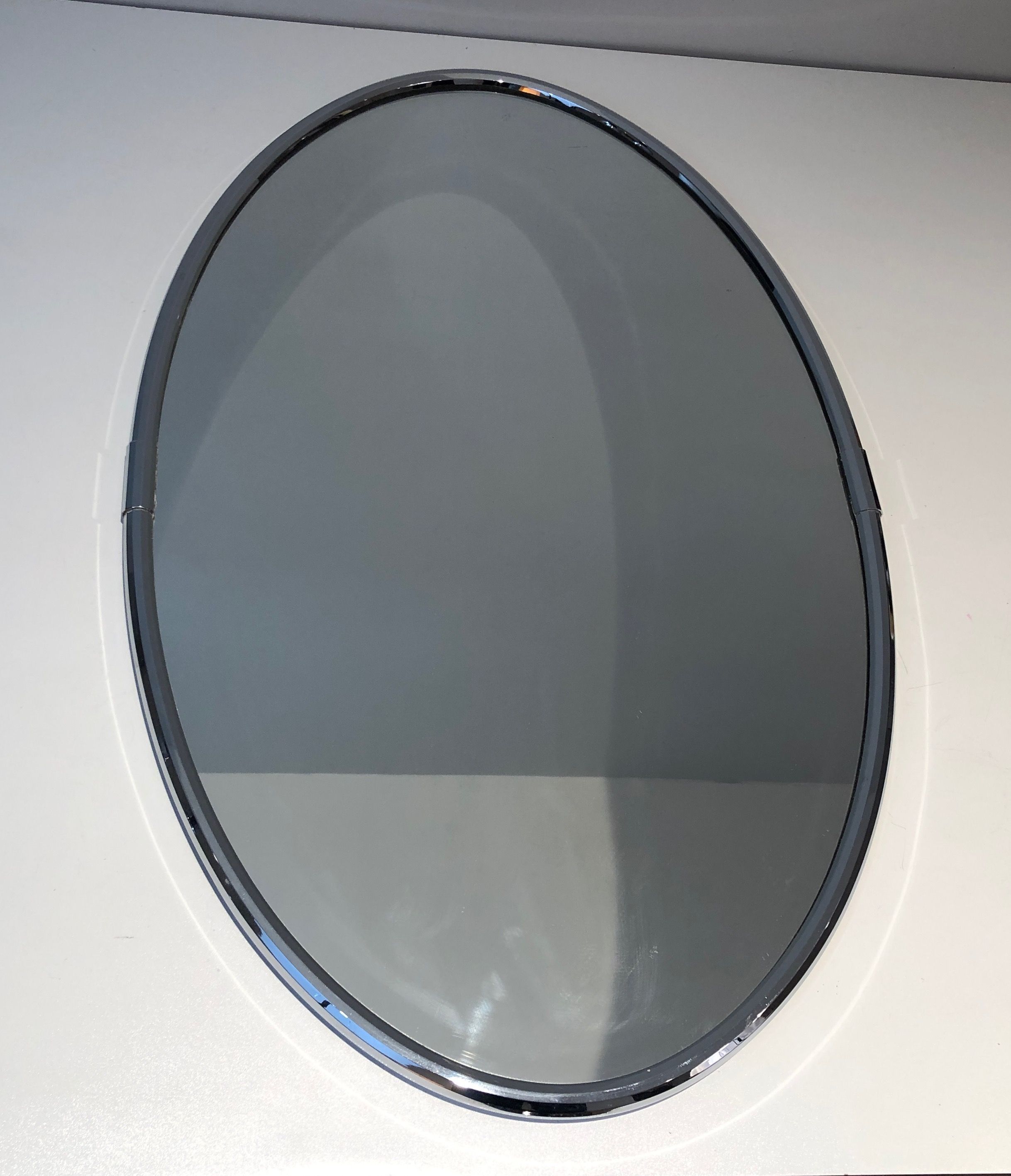 Oval chrome mirror in Art Deco style. Circa 1970.