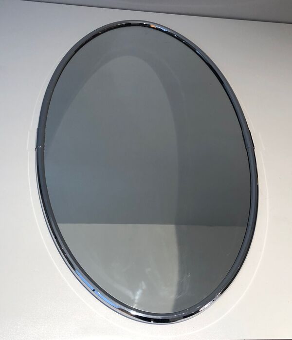 Miroir ovale chromé de style art déco. Vers 1970
