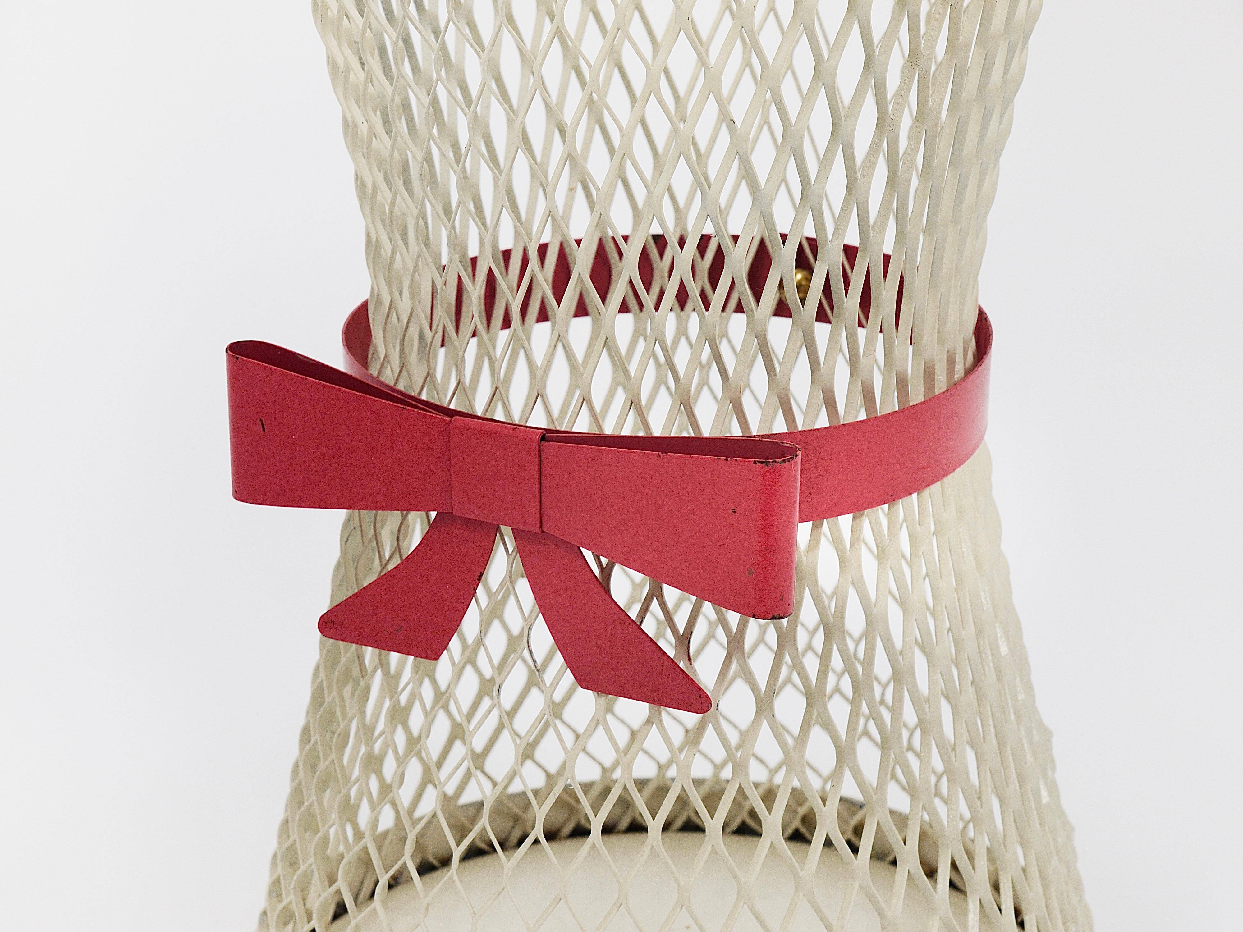 Bow tie umbrella stand in the style of Mathieu Matégot, mid-century, metal, France, 1950s.