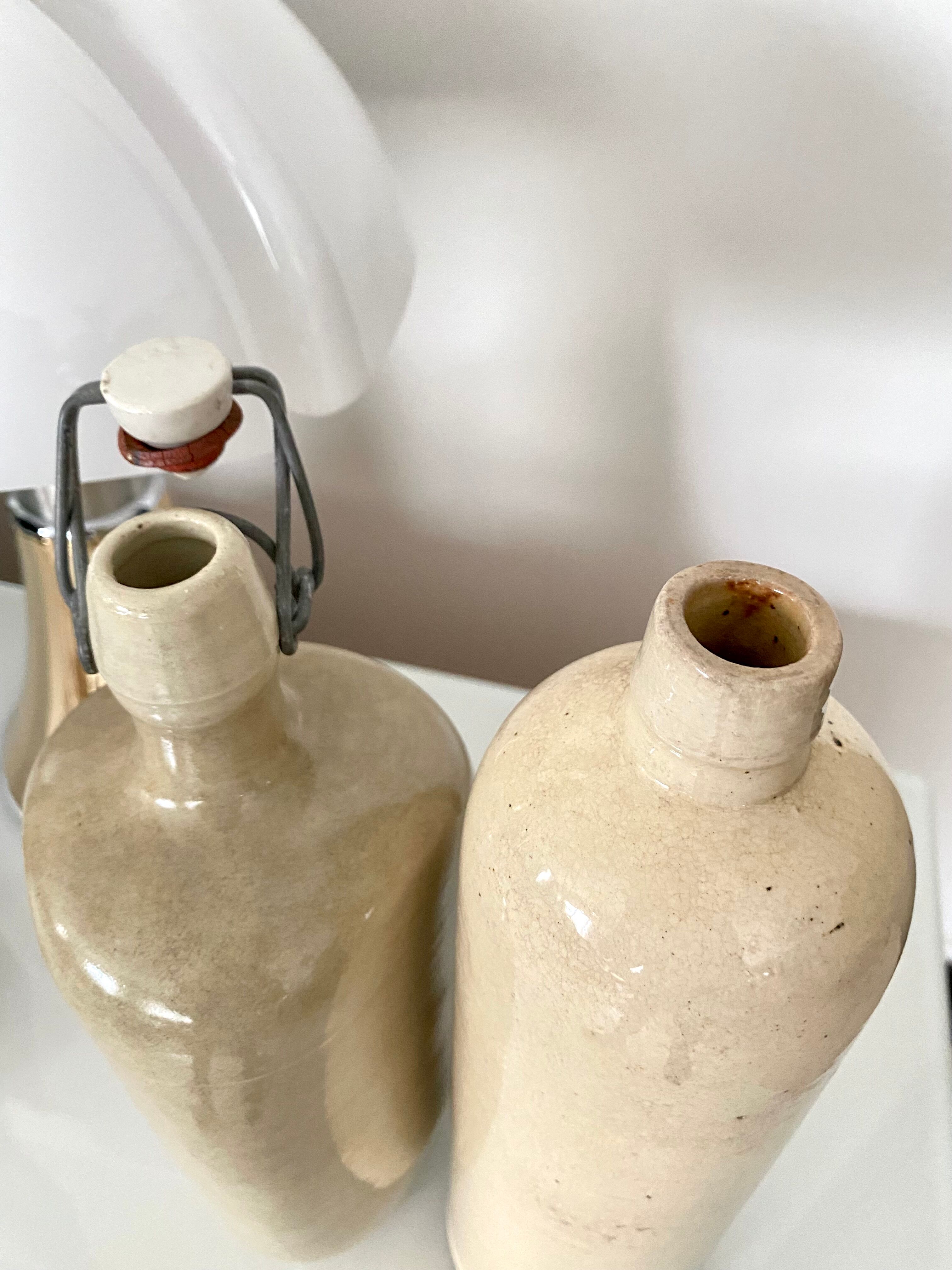 Set of 2 enamelled sandstone bottles