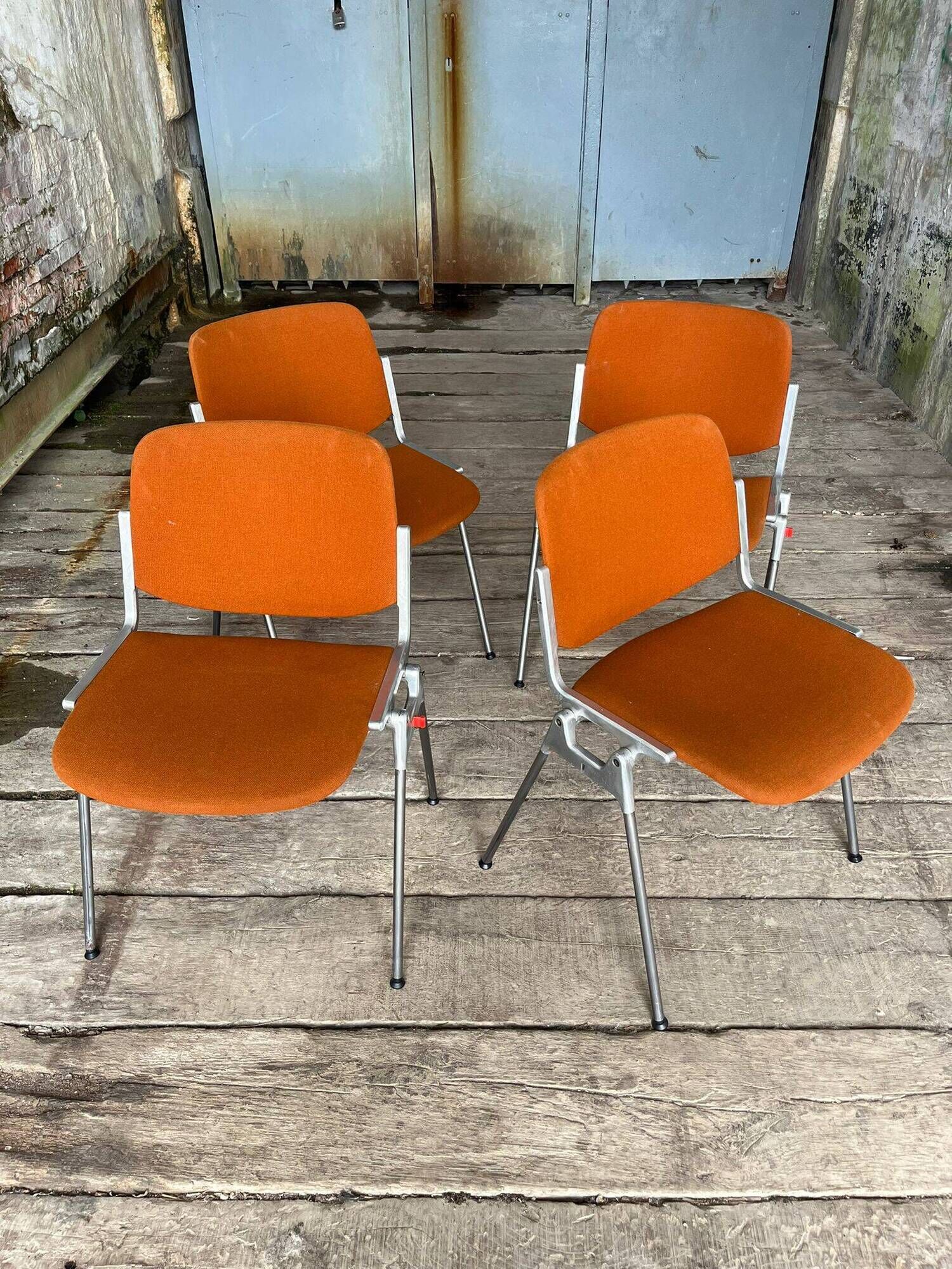 DSC 106 chair in orange by Giancarlo Piretti for Castelli, 1970s.