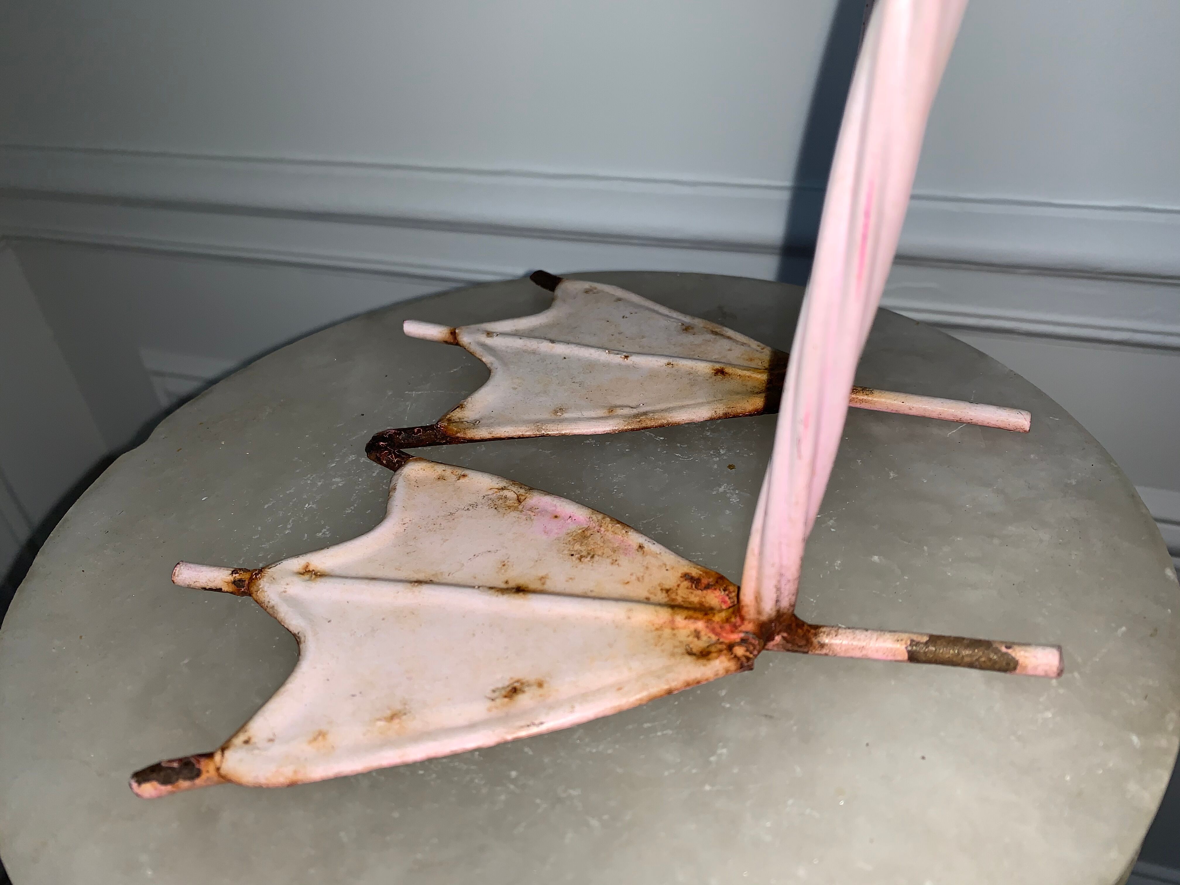 Old decorative pink flame in painted metal