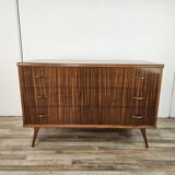 1950s chest of drawers covered in walnut with brass handles