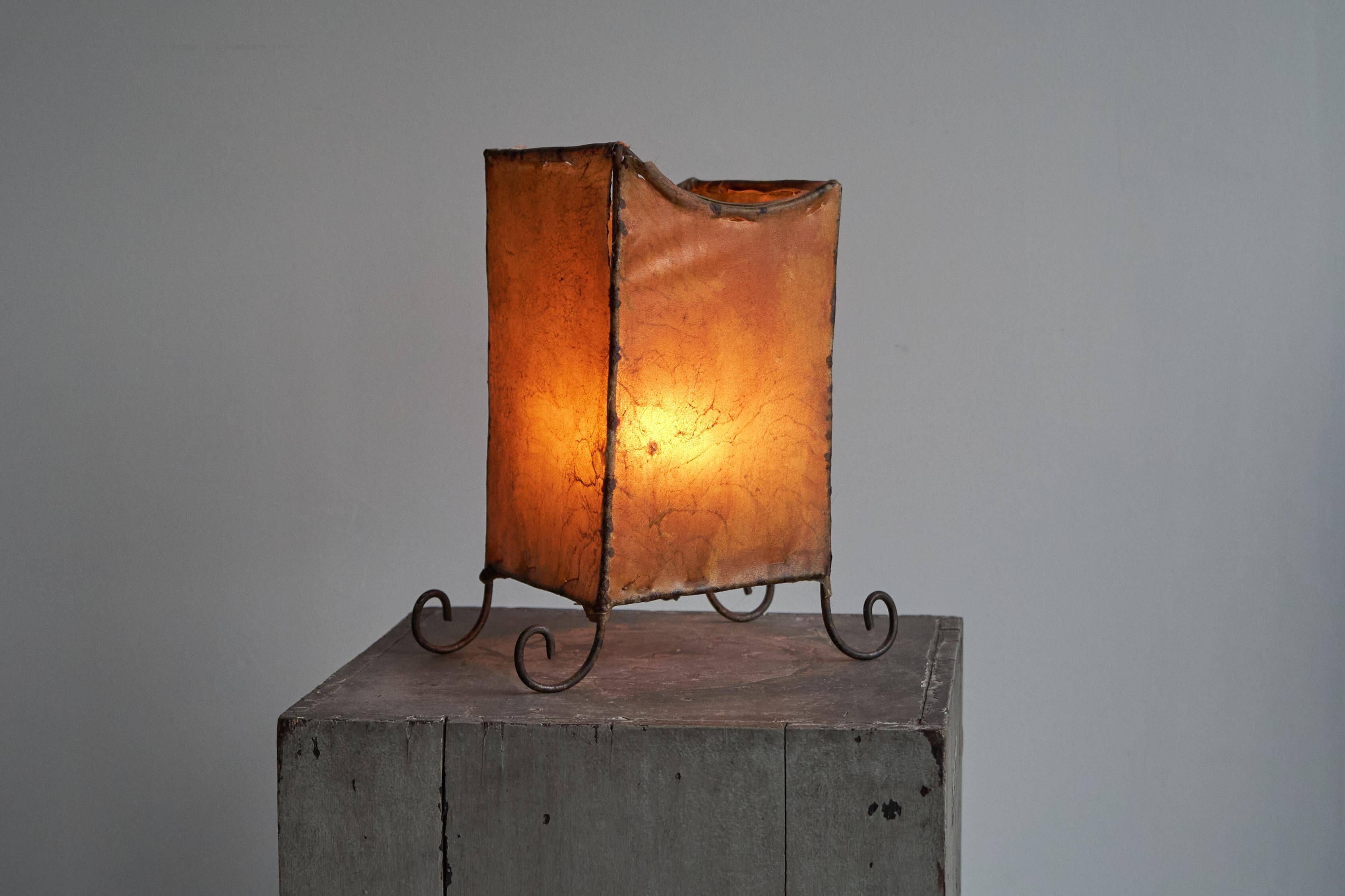 Mid-century table lamp in goat leather and wrought iron, 1950s
