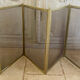 Five-panel golden metal fireplace screen from the 19th century.