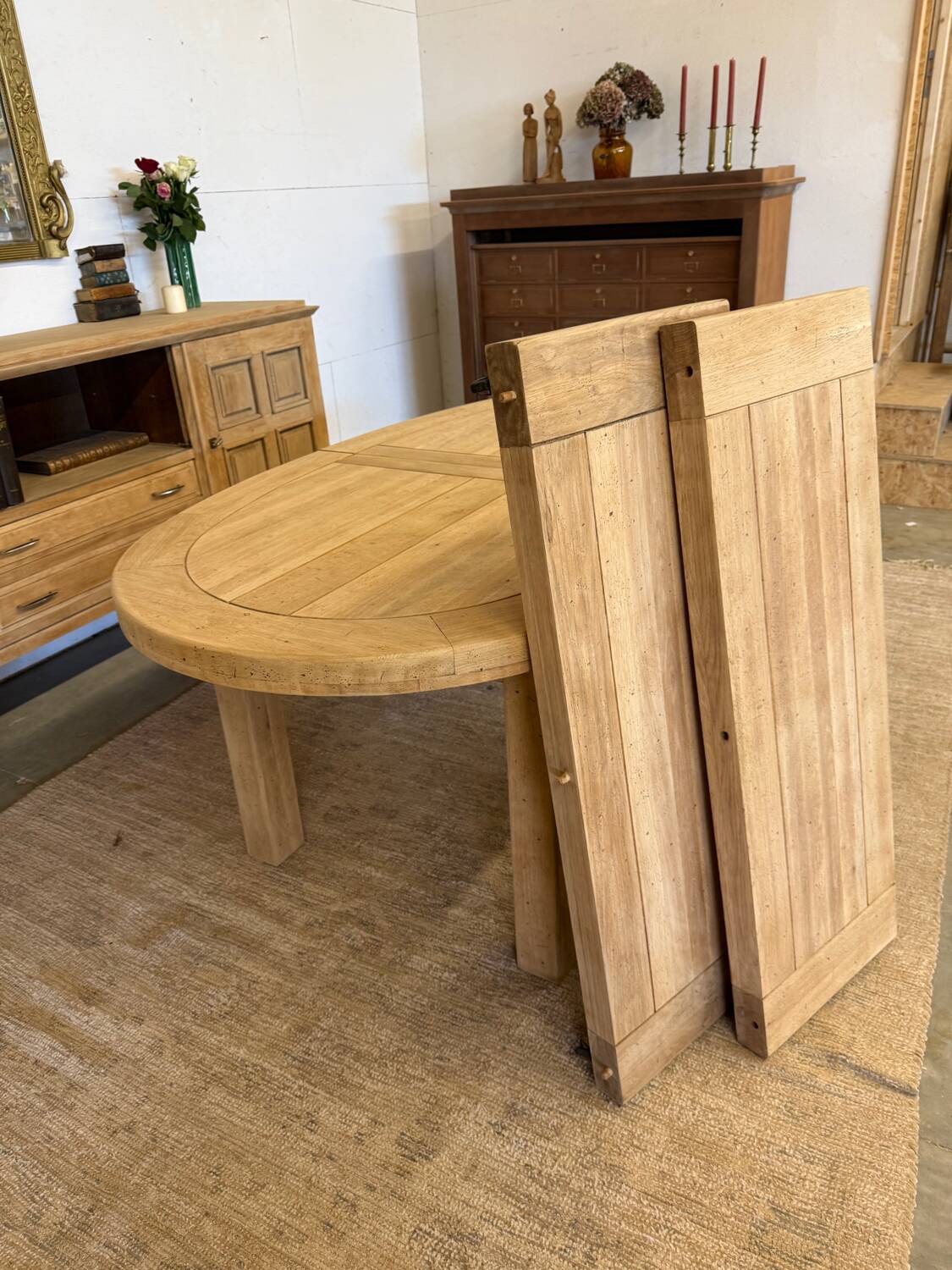Oval farmhouse table in solid oak with extensions.
