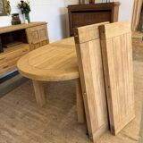 Oval farmhouse table in solid oak with extensions.