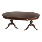 Table ovale extensible en acajou verni, pattes de lion et détails doré