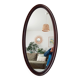Oval antique mirror in solid wood from the 1960s.