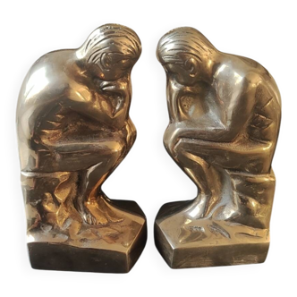 Pair of bookends inspired by Rodin's The Thinker. In gilt bronze
