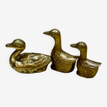 Three small old brass ducks