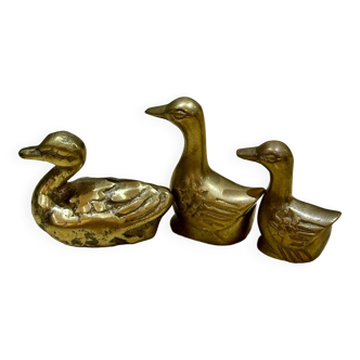Three small old brass ducks