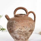 Old water jug. Gargoulette. Old terracotta pitcher.