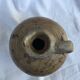 Ancient jug in glazed sandstone