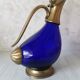 Glass and brass decanter