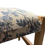 Square pouf with a checkered pattern.