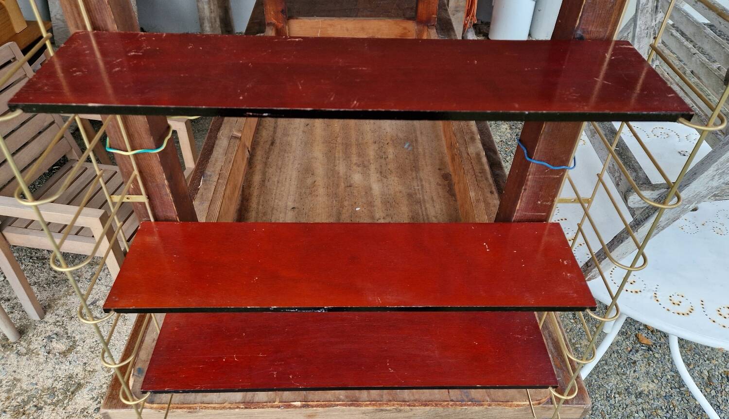 Gold metal wall shelf