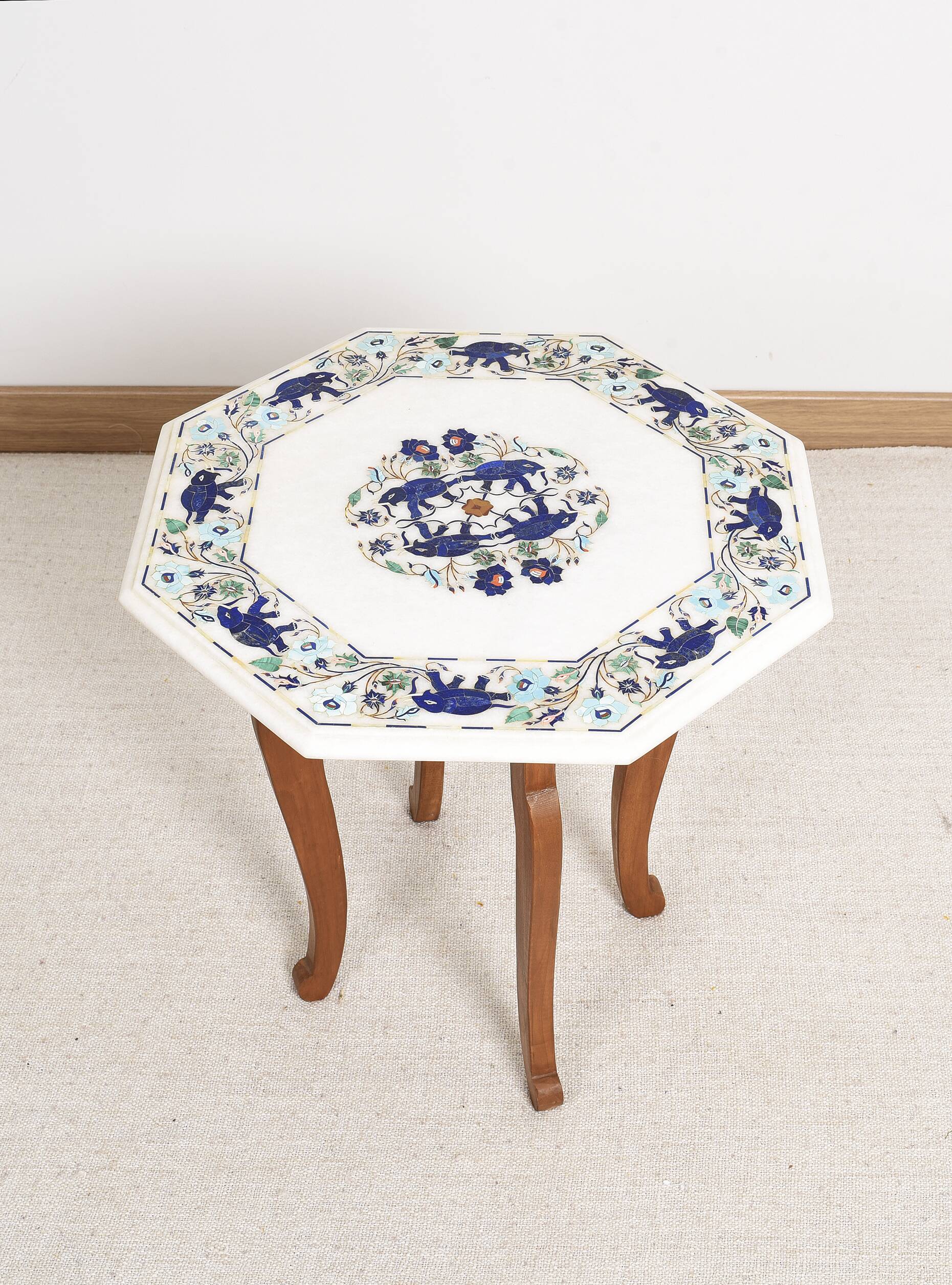 Side table with marble top and inlaid stones