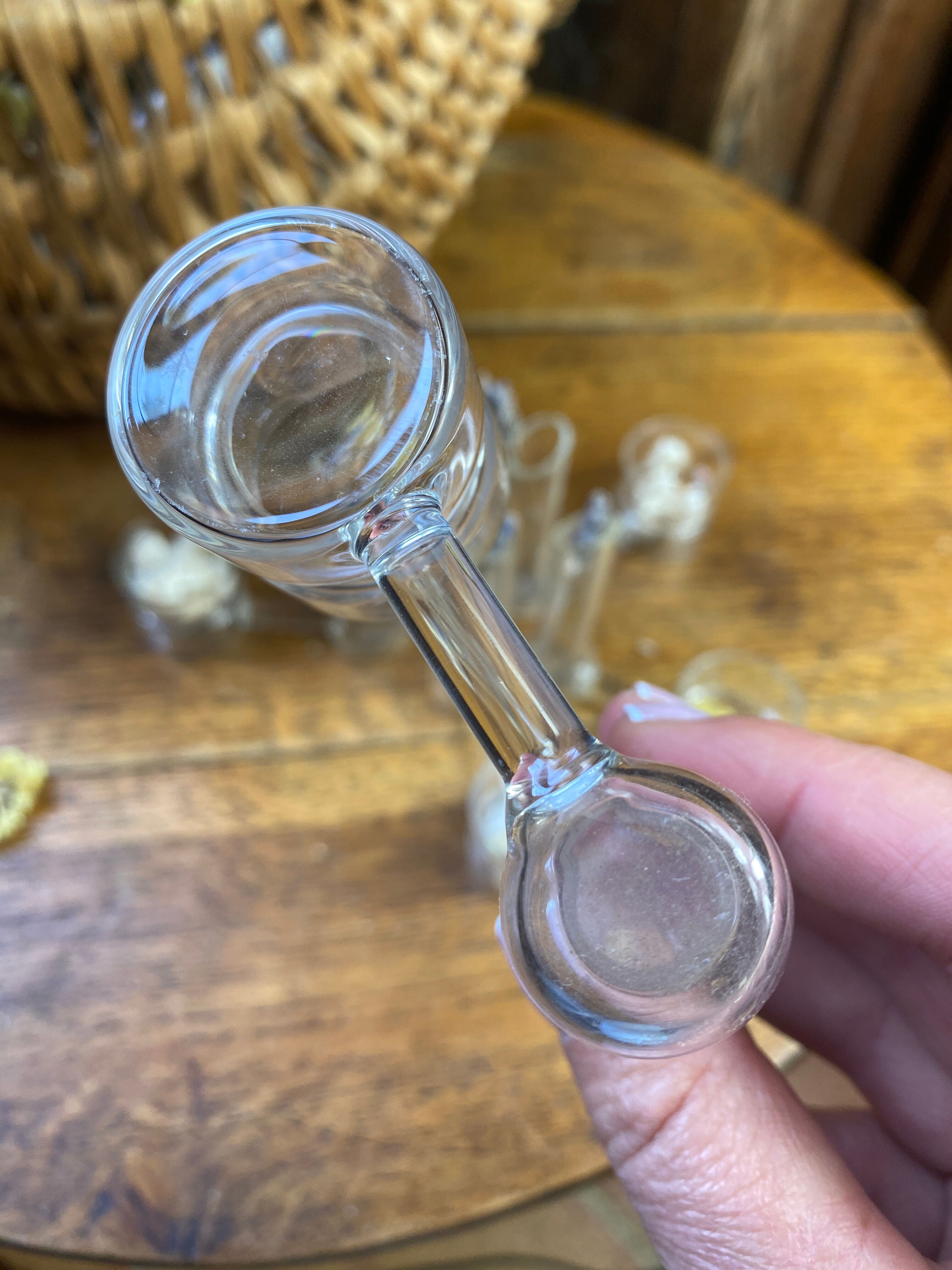 Knife rests, flower vases and candle holders in blown glass.