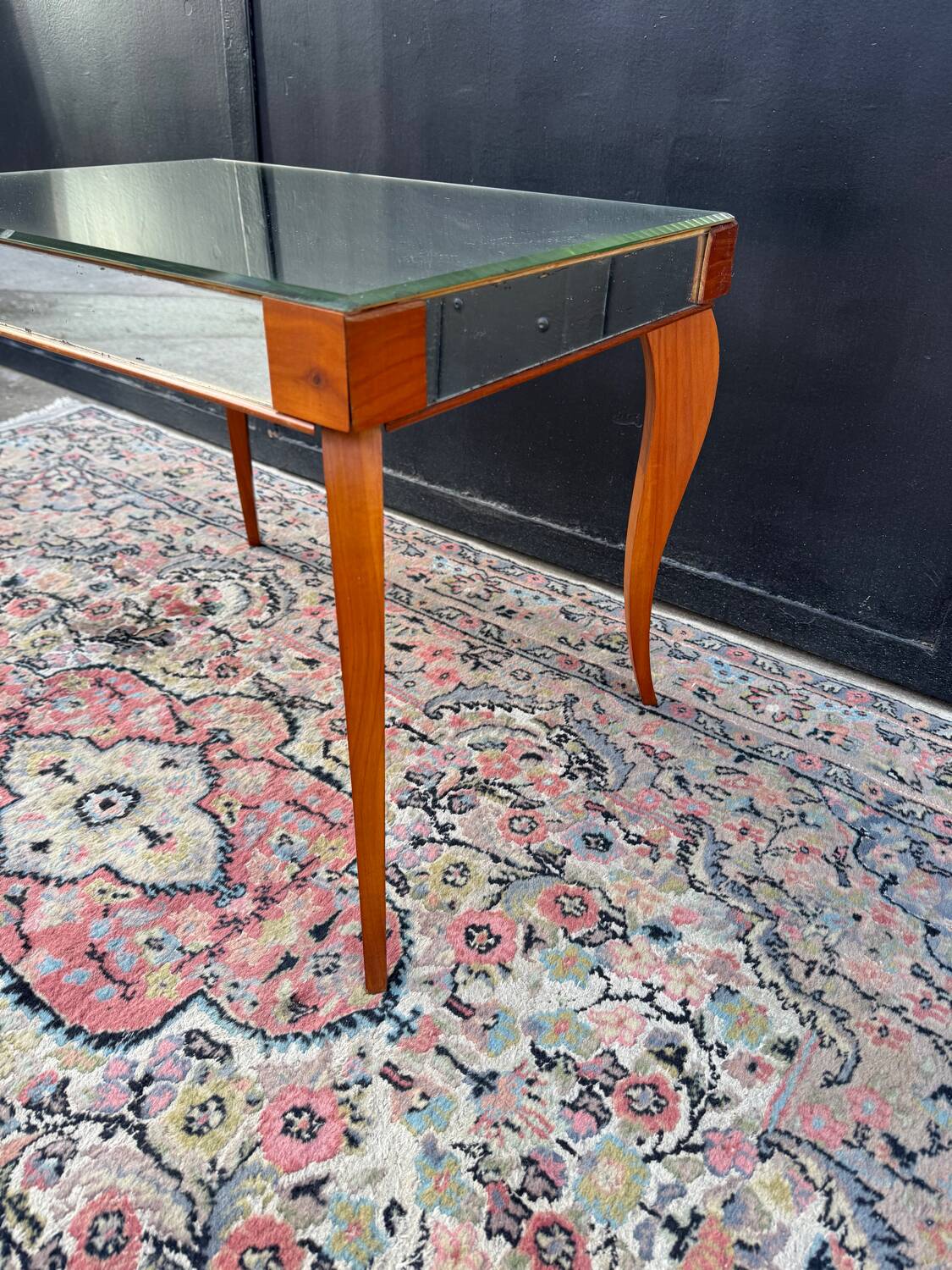 Small wooden coffee table with a mirror from the 1950s.