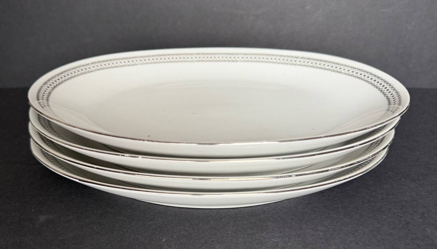 4 small oval porcelain dishes