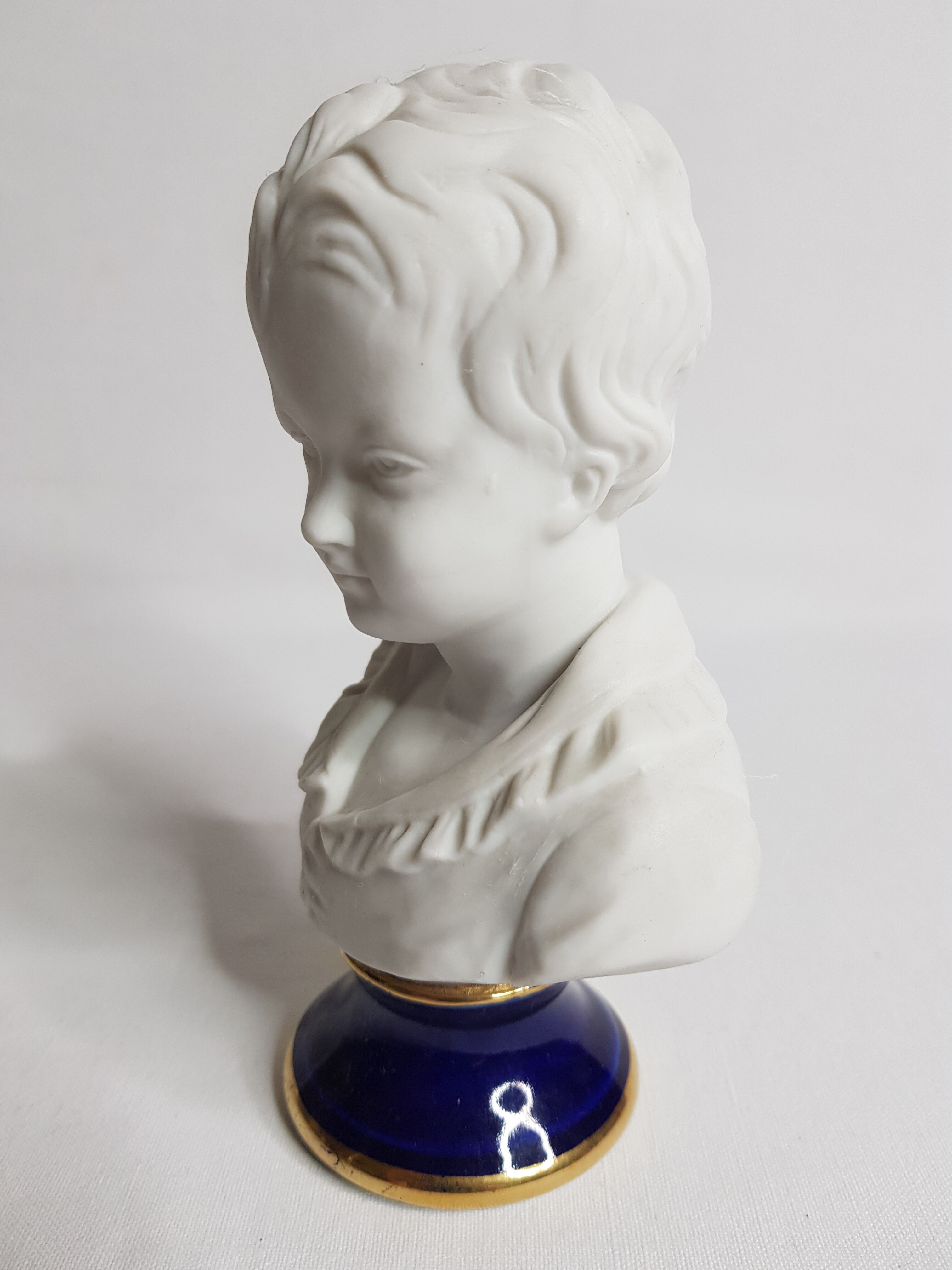 Porcelain biscuit bust, child, Alexandre Brongniart after Houdon
