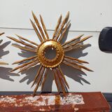 2 wooden sun mirrors and golden plaster
