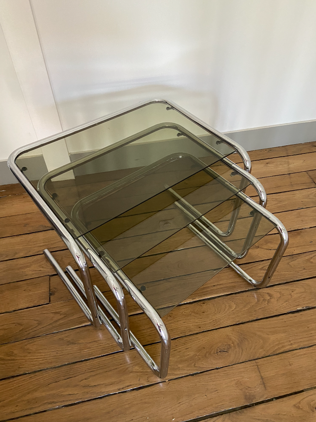 Vintage chrome trundle tables and smoked glasses 1970