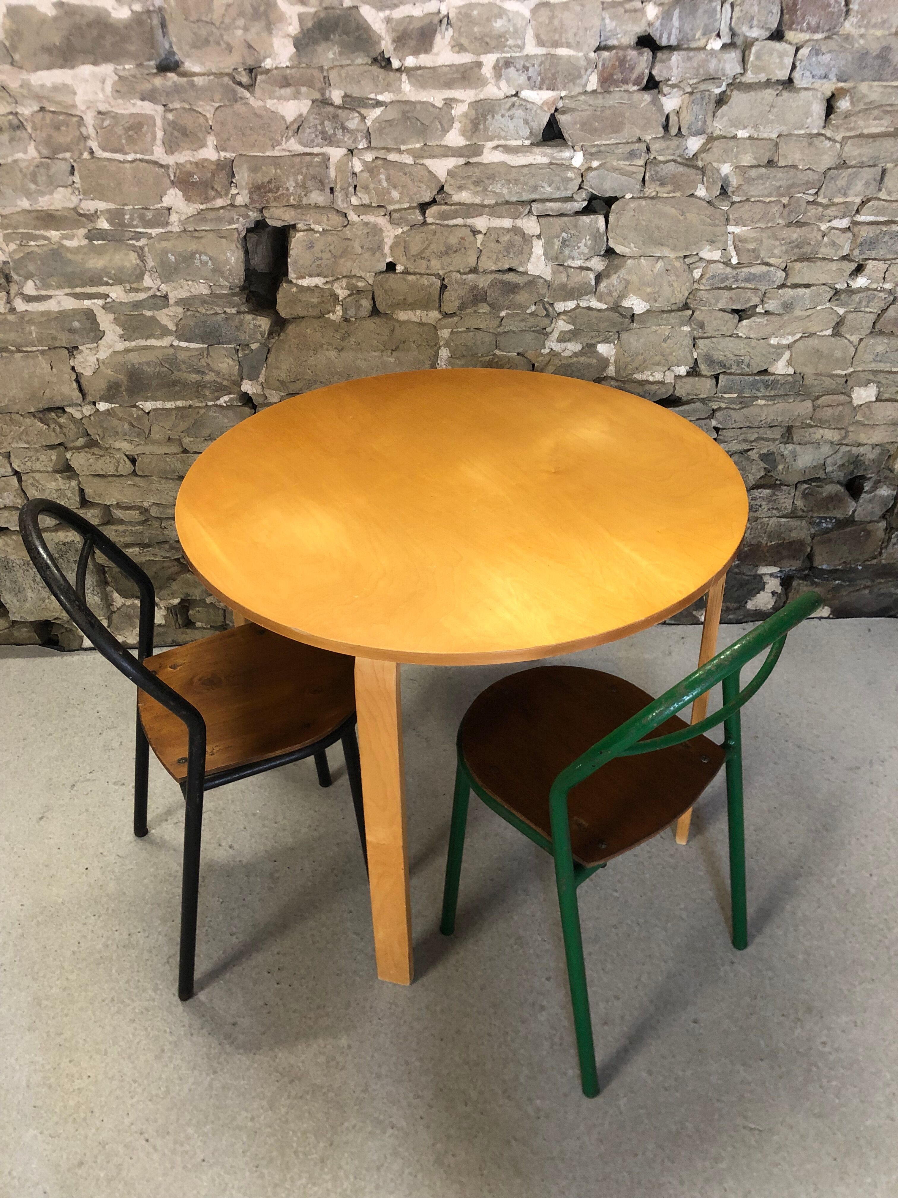 Round dining table in vintage wood