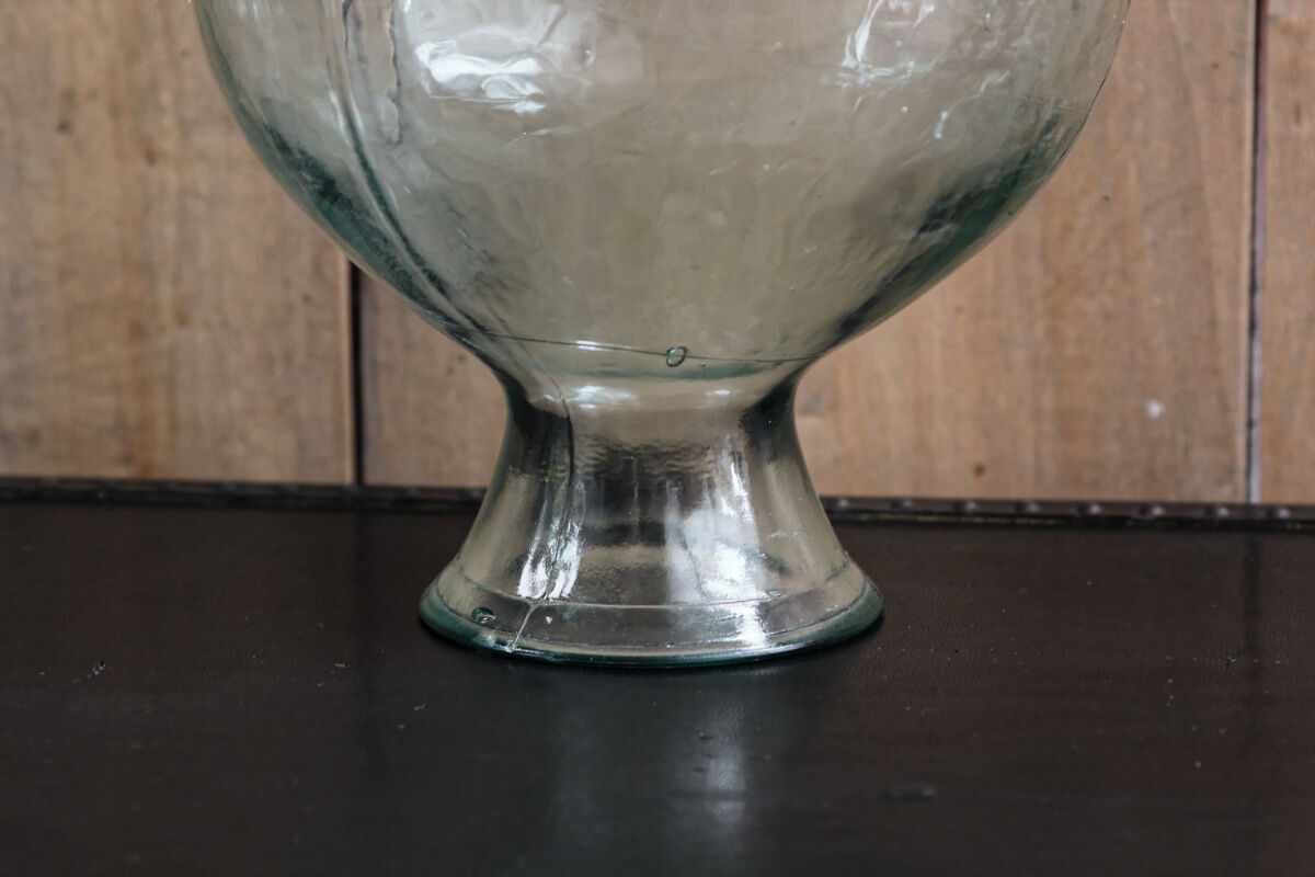 Old blown glass bottle, amphora-shaped