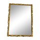 Miroir biseauté baroque aux fleurs sculptées et dorées
