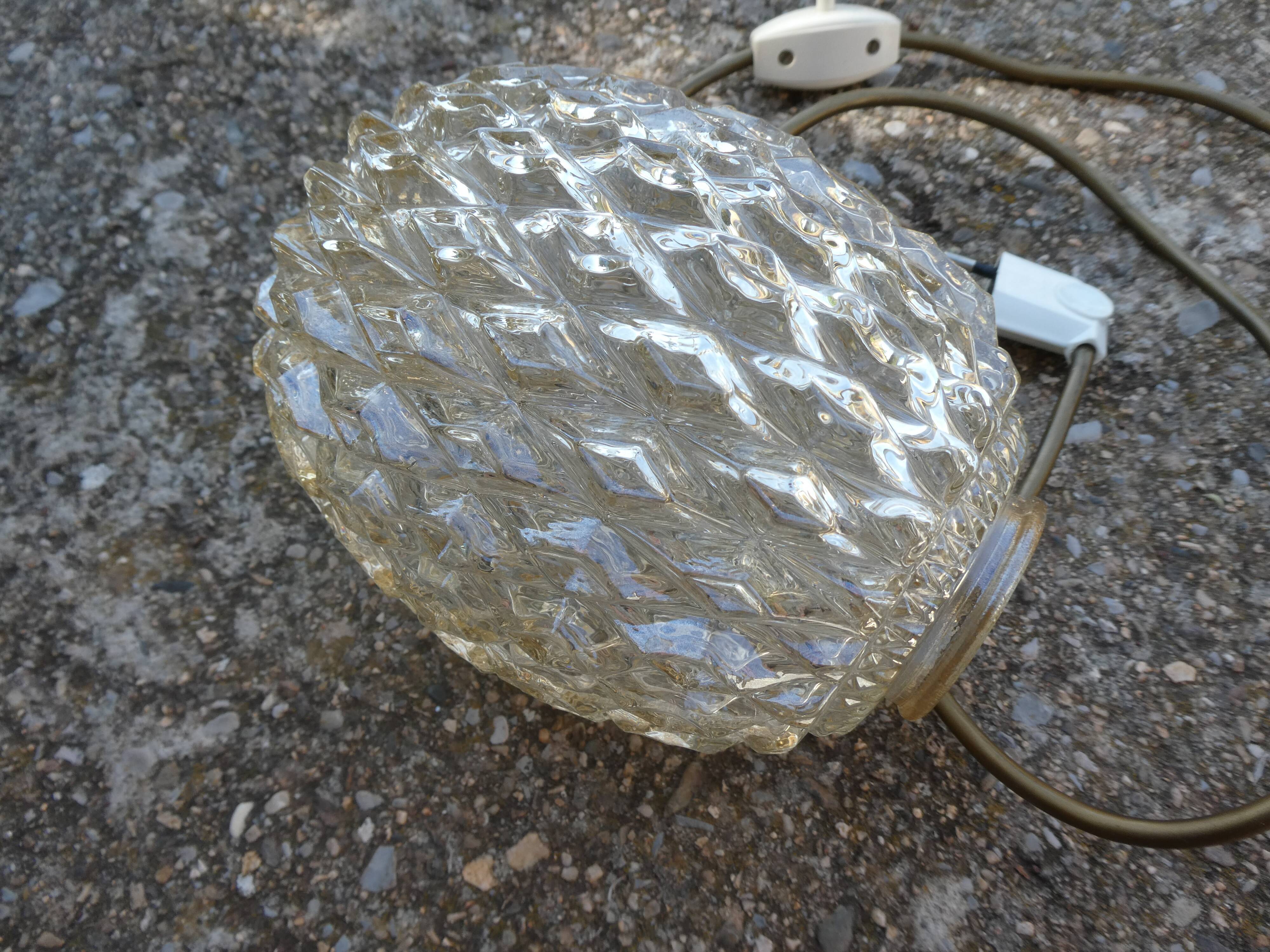 Vintage table lamp with chiseled glass globe.