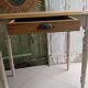 Antique wooden desk with a patinated base