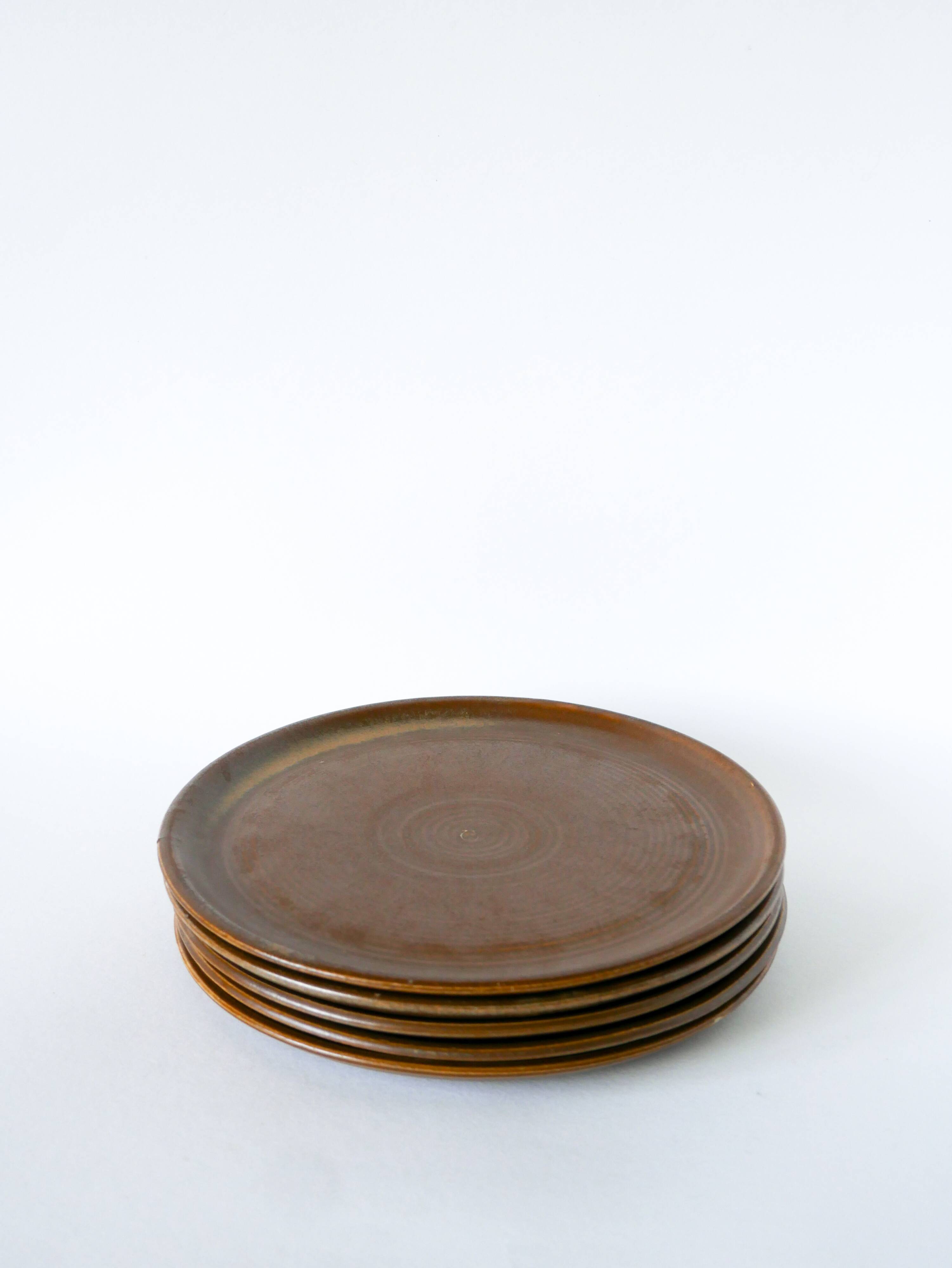 Set of 5 large flat plates in stoneware, 1970.
