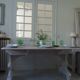 Console table in walnut with drop-leaf extensions, grey patinated base.
